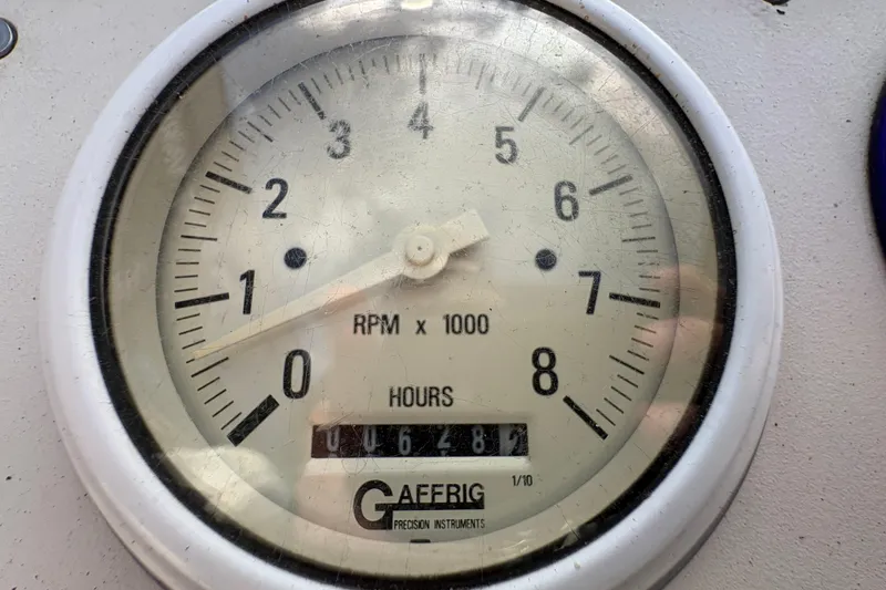 Slide: The Image of Tachometer gauge showing RPM and hours on a 2002 Formula 292 FASTech boat. - 20