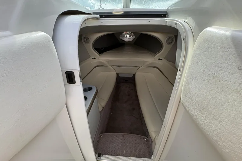Slide: The Image of Interior cabin of a 2002 Formula 292 FASTech boat, featuring beige seating and compact design. - 22