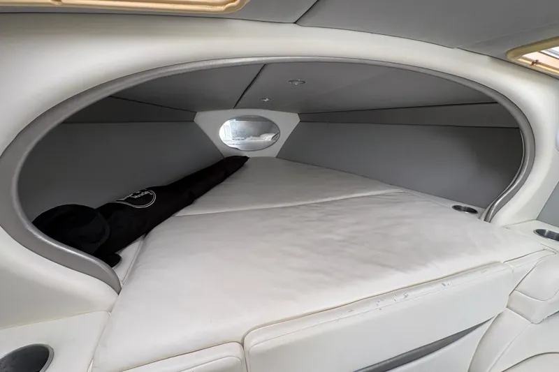 Slide: The Image of Interior cabin of a 2002 Formula 292 FASTech boat, featuring a cozy sleeping area. - 23