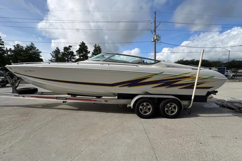 Slide: The Image of 2002 Formula 292 FASTech boat on trailer, featuring sleek design and vibrant graphics. - 7