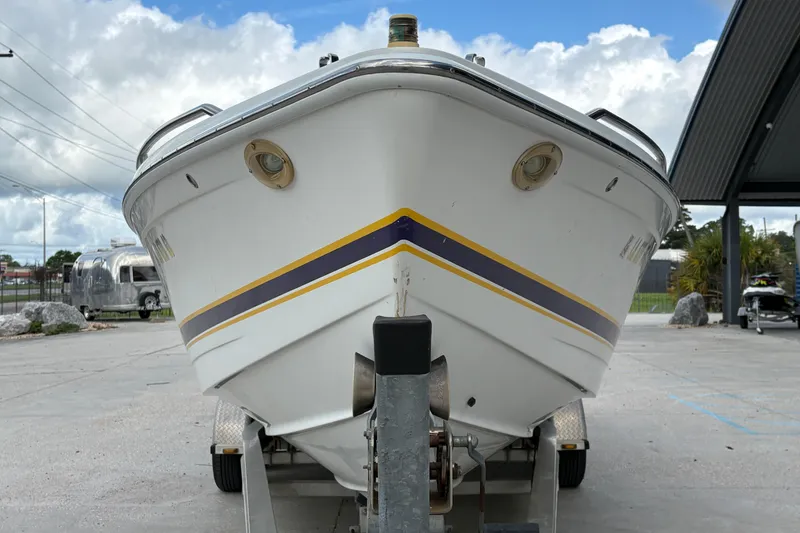 Slide: The Image of 2002 Formula 292 FASTech boat on trailer, front view, under cloudy sky. - 9