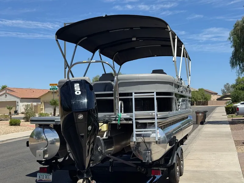 Slide: The Image of 2021 Lowe SS pontoon boat with Mercury engine on trailer. - 7