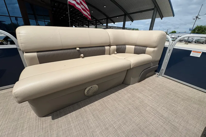 Slide: The Image of 2021 Sun Tracker Party Barge 20 DLX pontoon boat with beige seating and American flag. - 12