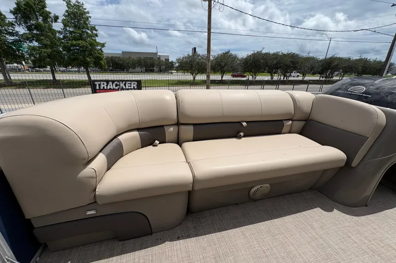 Slide: The Image of Beige seating on 2021 Sun Tracker Party Barge 20 DLX pontoon boat under cloudy sky. - 13