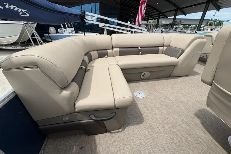 Slide: The Image of 2021 Sun Tracker Party Barge 20 DLX with beige seating and spacious deck. - 19