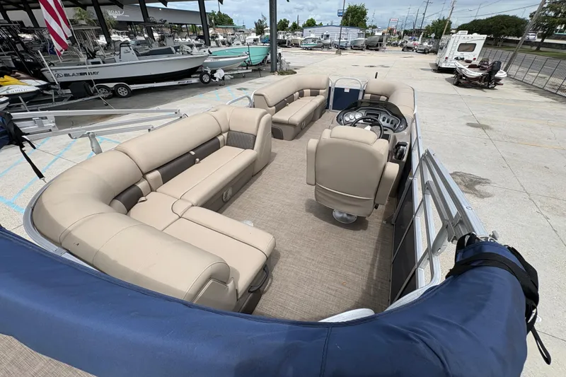 Slide: The Image of 2021 Sun Tracker Party Barge 20 DLX pontoon boat with spacious seating and helm. - 21