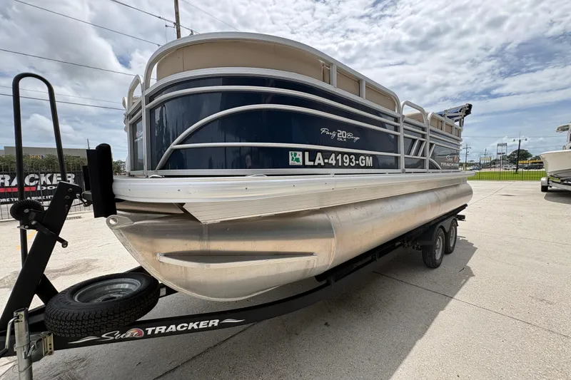 Slide: The Image of 2021 Sun Tracker Party Barge 20 DLX pontoon boat on trailer, parked outdoors. - 8