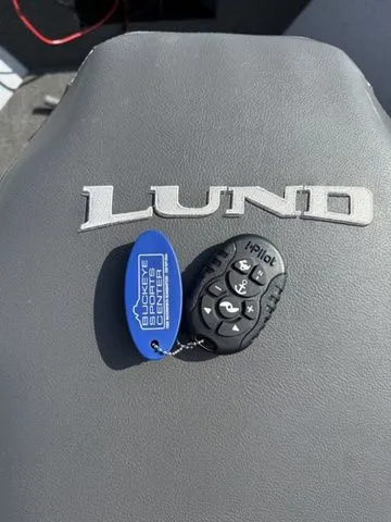 Slide: The Image of Lund 1400 Fury SS 2022 with a keychain and remote control. - 19