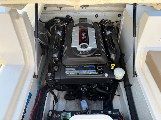 Slide: The Image of The engine compartment of a 2017 Sea Ray SDX 240 features a 6.3-liter, 300 horsepower engine. - 24