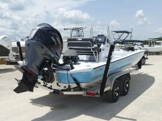Slide: The Image of 2026 Xpress Hyper-Lift H24B boat on trailer, outboard motor. - 4