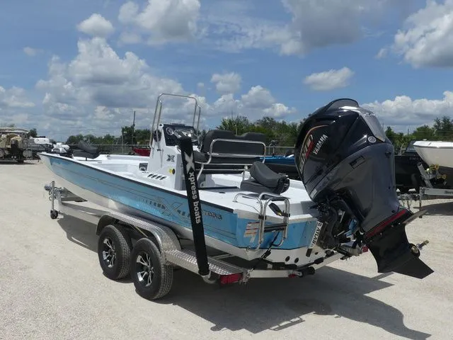 Slide: The Image of 2026 Xpress Hyper-Lift H24B boat with outboard motor. - 6