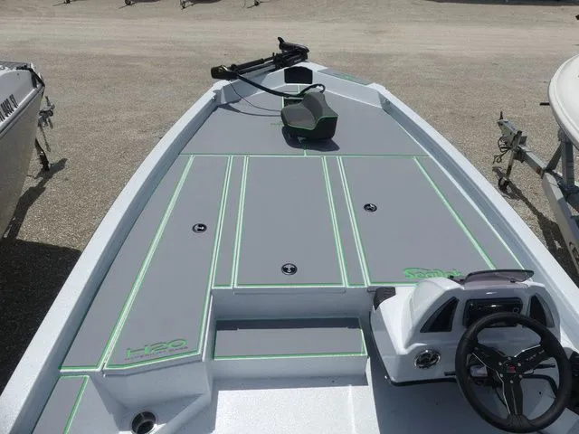 Slide: The Image of 2026 Xpress Hyper Lift H20B boat with gray deck and green accents. - 11