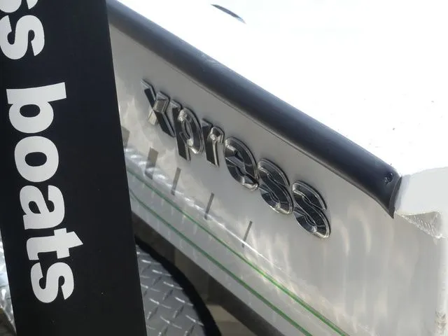 Slide: The Image of Close-up of Xpress Hyper Lift H20B boat logo, model 2026. - 7