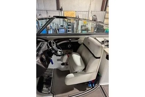 Slide: The Image of 2018 Cobalt A28 boat interior with steering wheel and white seating. - 15