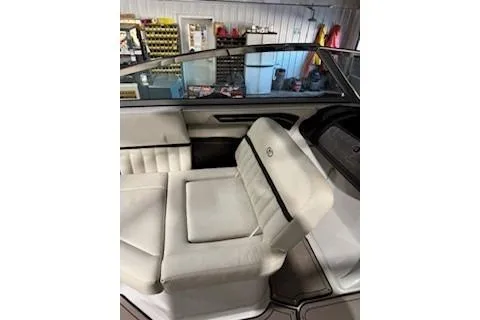 Slide: The Image of 2018 Cobalt A28 boat interior with white seating and sleek design. - 16