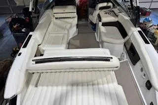 Slide: The Image of 2018 Cobalt A28 boat interior with luxurious white seating and modern design. - 20