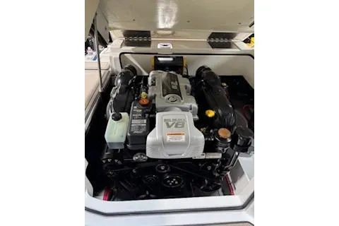 Slide: The Image of 2018 Cobalt A28 boat engine compartment with V8 engine visible. - 23
