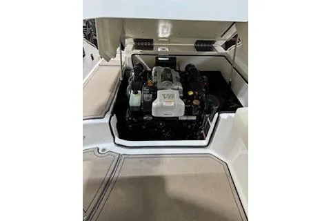 Slide: The Image of 2018 Cobalt A28 boat engine compartment with visible V8 engine components. - 28