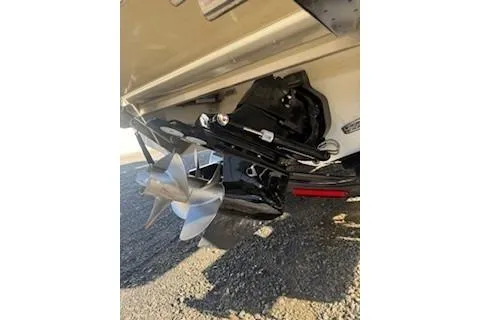 Slide: The Image of 2018 Cobalt A28 boat propeller and stern drive on gravel surface. - 5