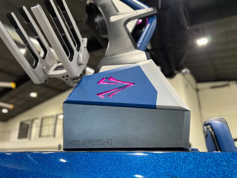 Slide: The Image of 2021 Supra SL 400 boat with sleek design and logo. - 11