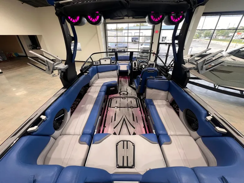 Slide: The Image of Interior of a 2021 Supra SL 400 boat with blue and gray seating. - 17