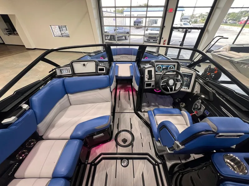 Slide: The Image of Interior of a 2021 Supra SL 400 boat with blue seating. - 19