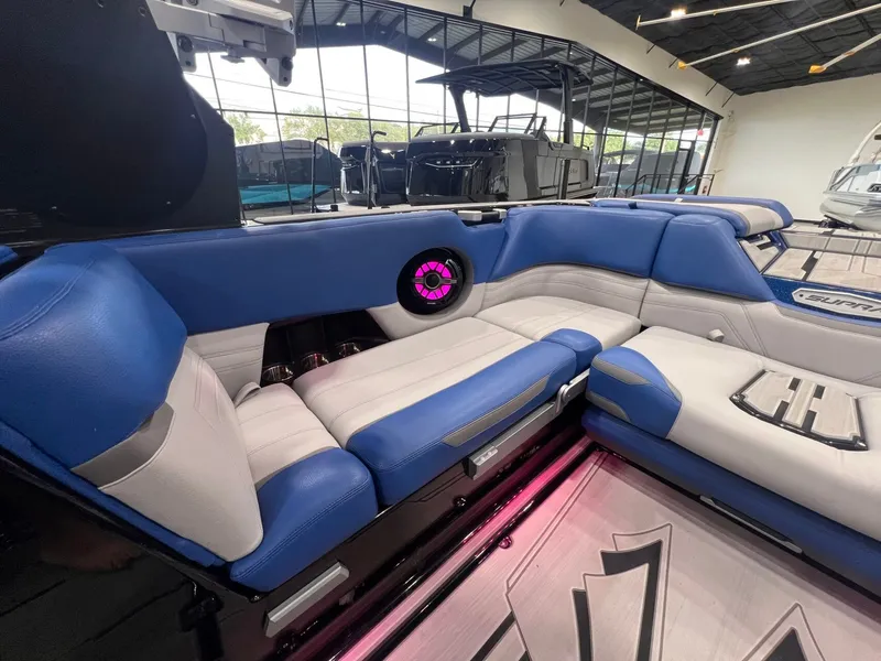Slide: The Image of Interior of a 2021 Supra SL 400 with blue and white seating. - 21