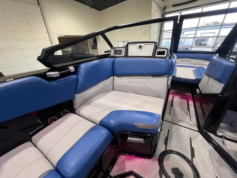 Slide: The Image of Interior of a 2021 Supra SL 400 with blue and white seating. - 23