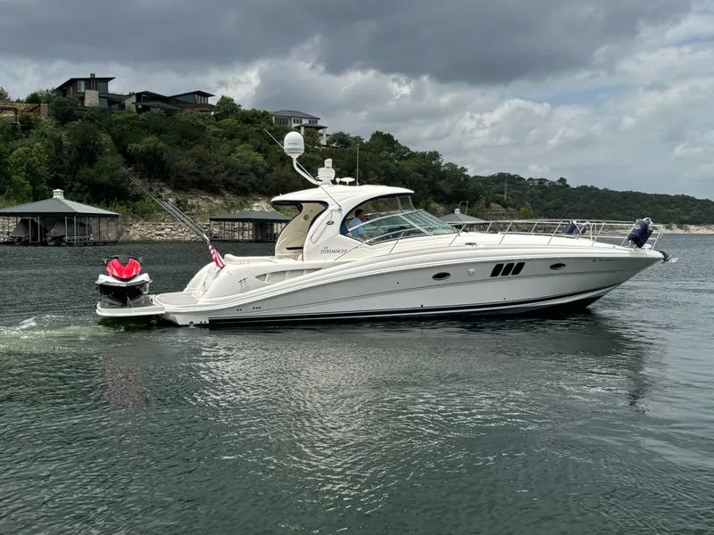 The Image of 2008 Sea Ray 44 Sundancer yacht on calm waters. - 1