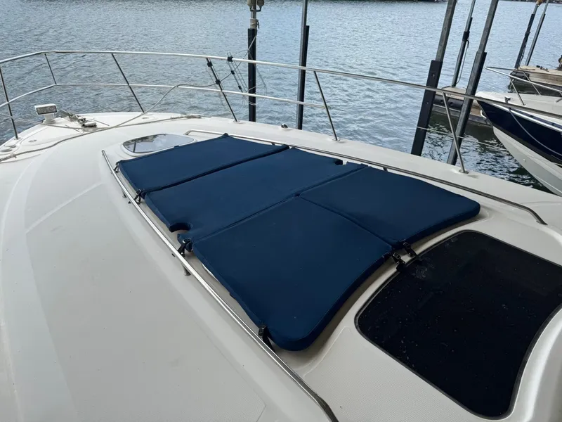 Slide: The Image of 2008 Sea Ray 44 Sundancer with blue deck cover. - 16