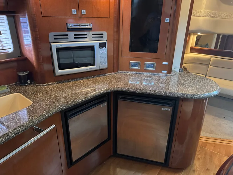Slide: The Image of Interior of 2008 Sea Ray 44 Sundancer with kitchen and appliances. - 25