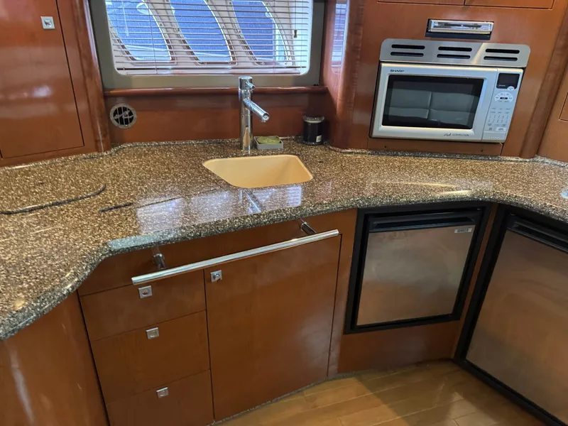 Slide: The Image of Sea Ray 44 Sundancer 2008 kitchen area with granite countertop. - 26