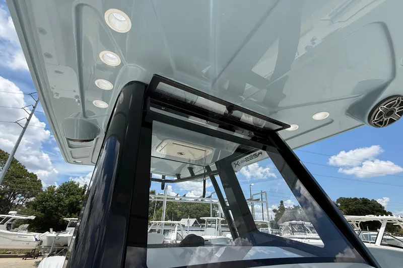 Slide: The Image of 2026 World Cat 265 CC-X boat with sleek design and modern features under a clear sky. - 15