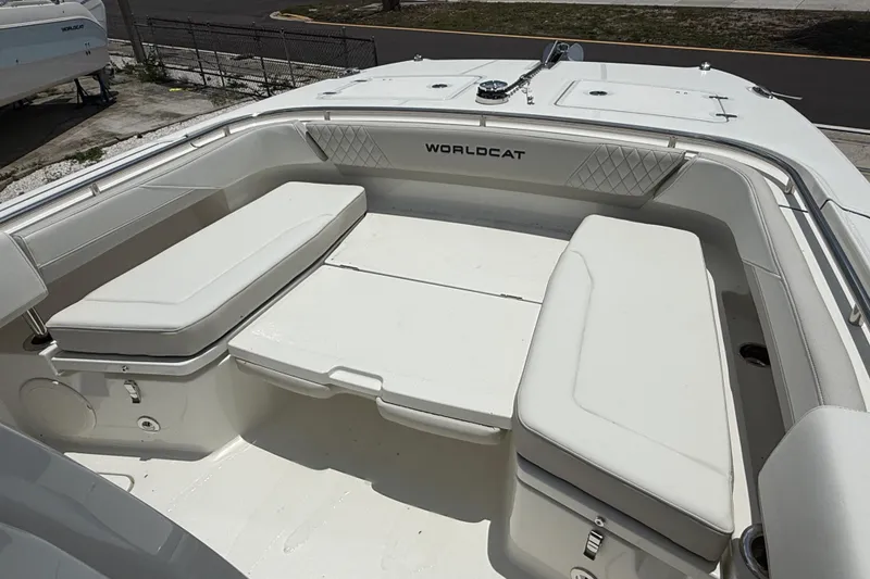 Slide: The Image of 2026 World Cat 265 CC-X boat interior with cushioned seating and storage compartments. - 19