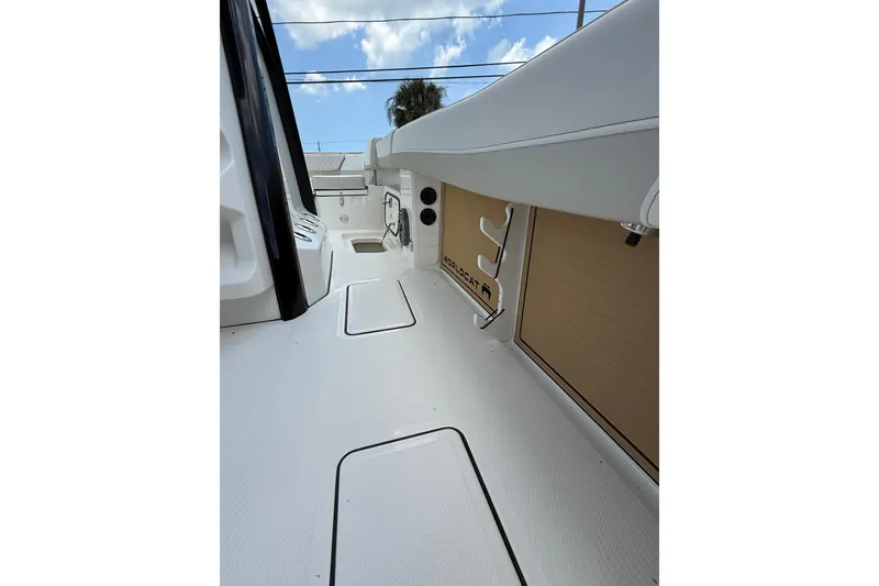 Slide: The Image of 2026 World Cat 265 CC-X boat interior, showcasing sleek design and spacious deck layout. - 22