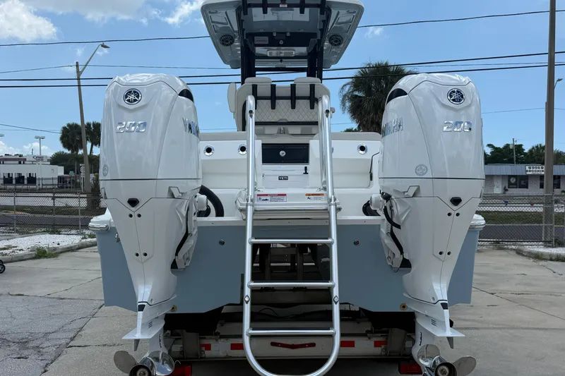 Slide: The Image of 2026 World Cat 265 CC-X boat with dual Yamaha 200 engines, rear view. - 3