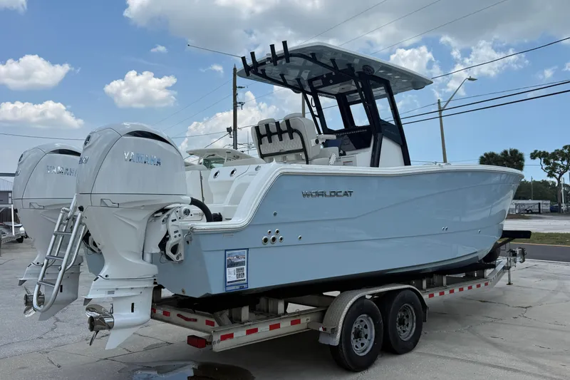 Slide: The Image of 2026 World Cat 265 CC-X boat on trailer, featuring dual Yamaha outboard engines. - 4