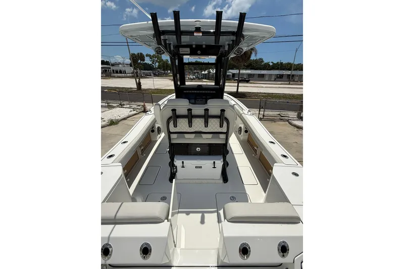 Slide: The Image of 2026 World Cat 265 CC-X boat interior with seating and helm station. - 6