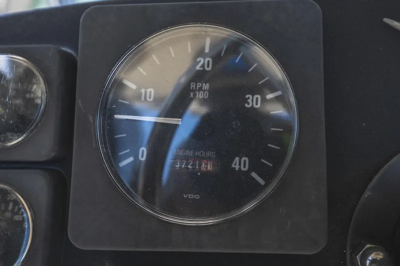 Slide: The Image of RPM gauge of 1986 Bertram 35 Flybridge Sportfish showing engine hours. - 14