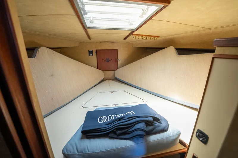 Slide: The Image of Interior cabin of a 1986 Bertram 35 Flybridge Sportfish boat with bedding. - 21