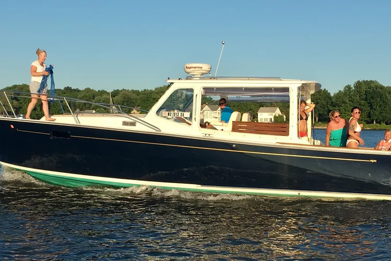 The Image of 2006 MJM 34z Downeast boat cruising with passengers on a sunny day. - 0
