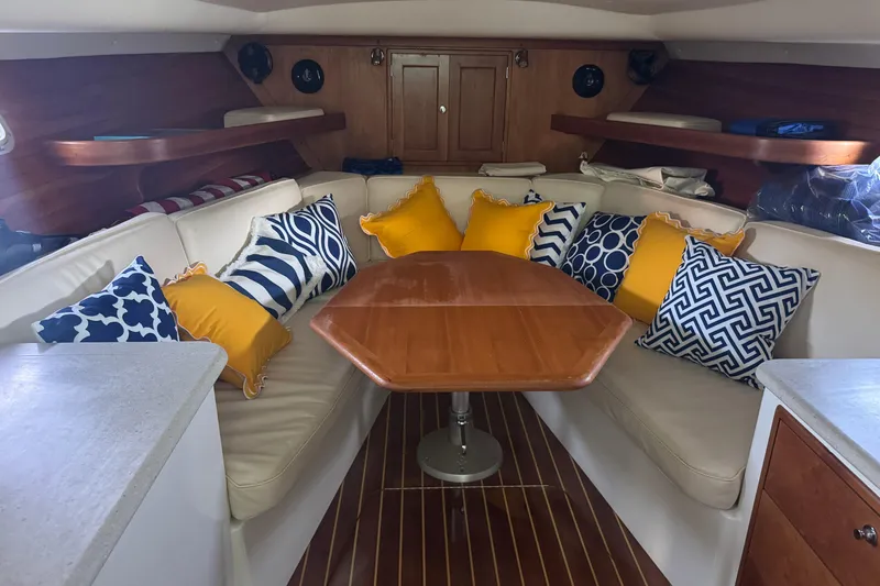 Slide: The Image of Luxurious 2006 MJM 34z Downeast yacht interior with elegant seating and vibrant cushions. - 11