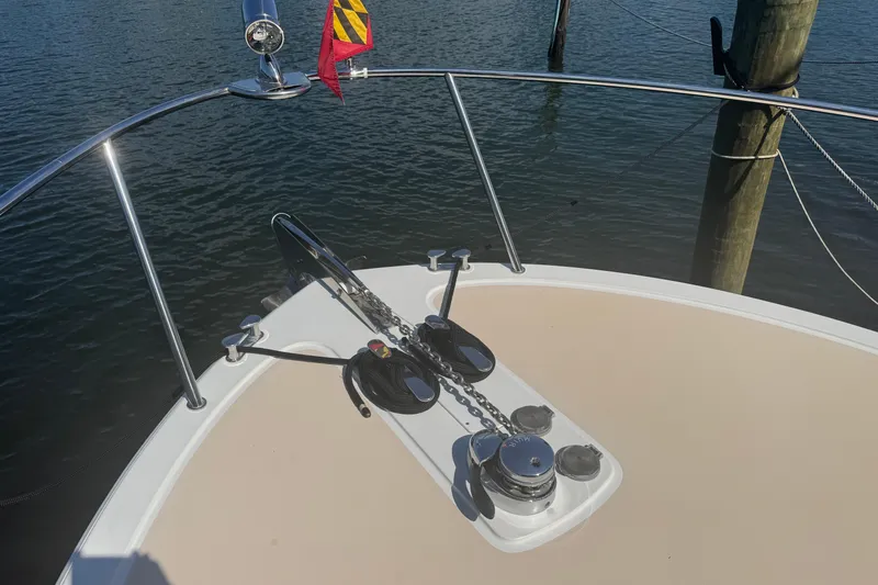 Slide: The Image of Bow of 2006 MJM 34z Downeast boat with anchor and railing in marina. - 3