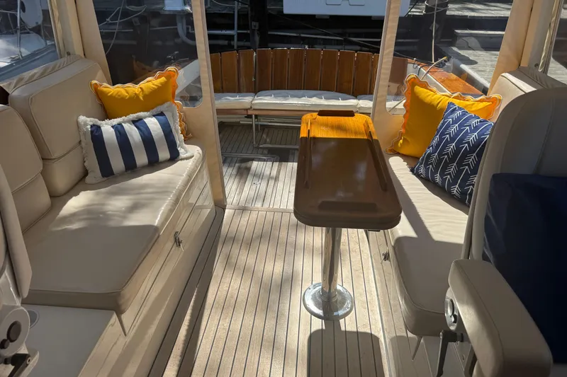 Slide: The Image of Interior of 2006 MJM 34z Downeast boat with cushioned seating and decorative pillows. - 7