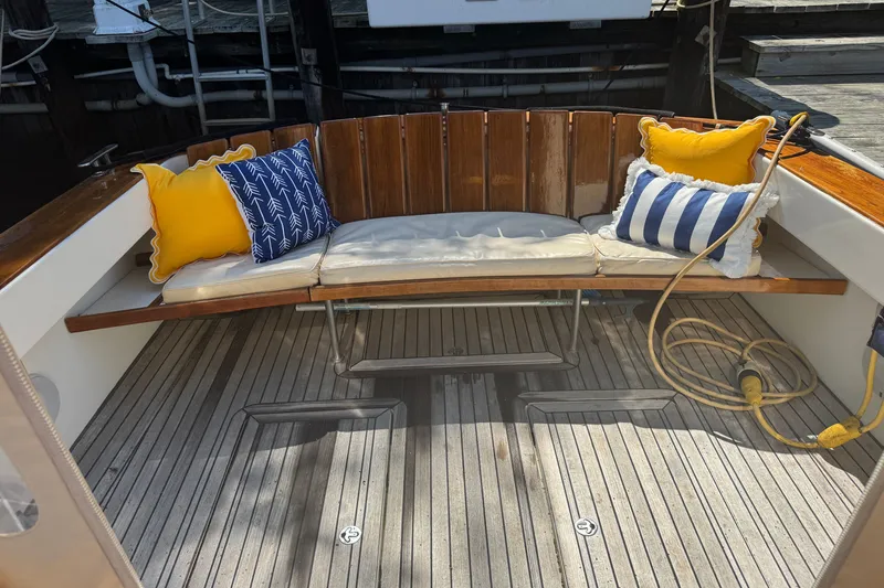 Slide: The Image of Cozy seating area on 2006 MJM 34z Downeast boat with colorful cushions. - 3