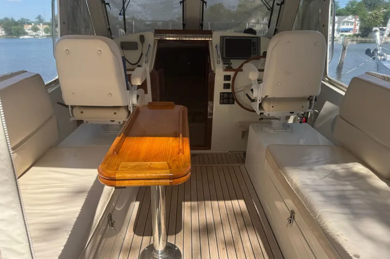 Slide: The Image of Interior of 2006 MJM 34z Downeast boat with seating and wooden table. - 8