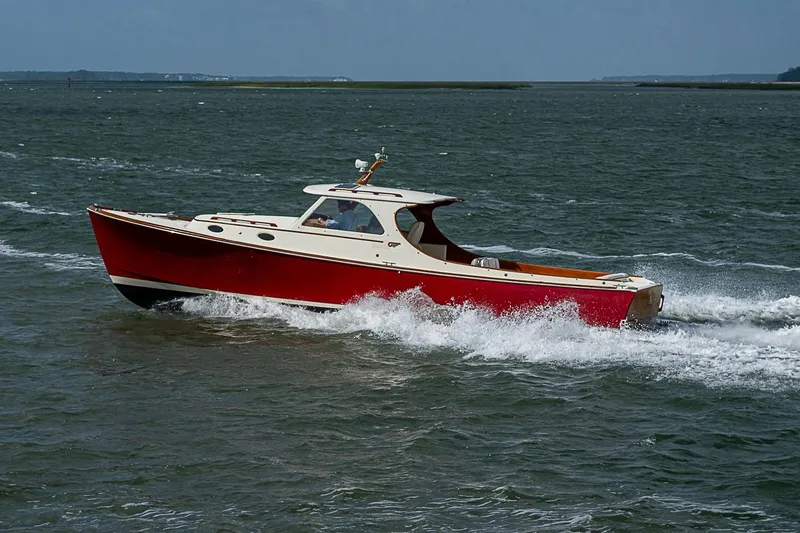 The Image of 1996 Hinckley Picnic Boat 36 Classic cruising on open water. - 1