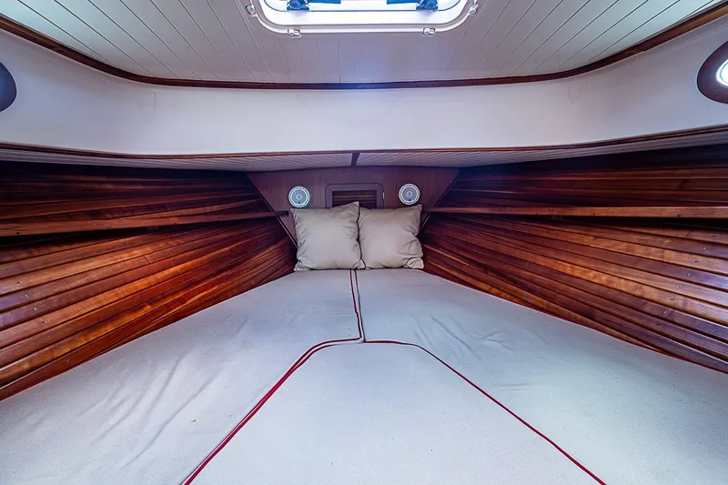 Slide: The Image of Cozy cabin interior of 1996 Hinckley Picnic Boat 36 Classic with wooden paneling. - 15