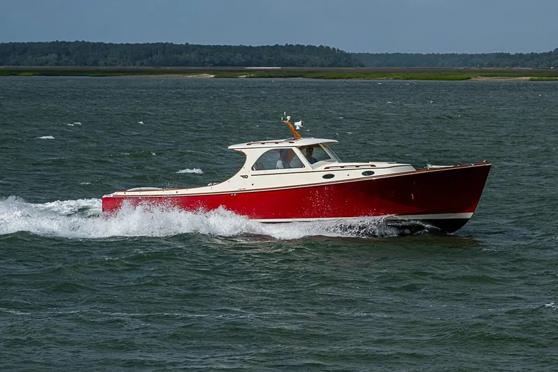 Slide: The Image of 1996 Hinckley Picnic Boat 36 Classic cruising on open water. - 4