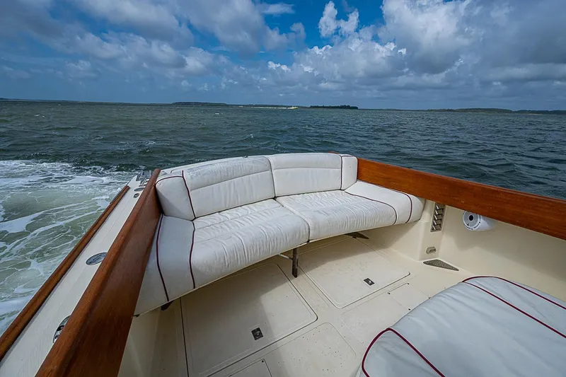 Slide: The Image of Hinckley Picnic Boat 36 Classic 1996, featuring elegant seating, cruising on open water. - 6